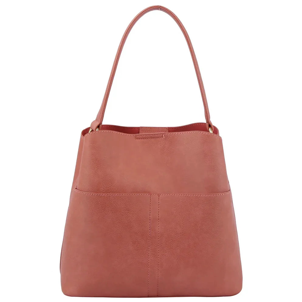 Pink leather Bucket Hobo Bag with a curved handle and guitar strap for stylish comfort