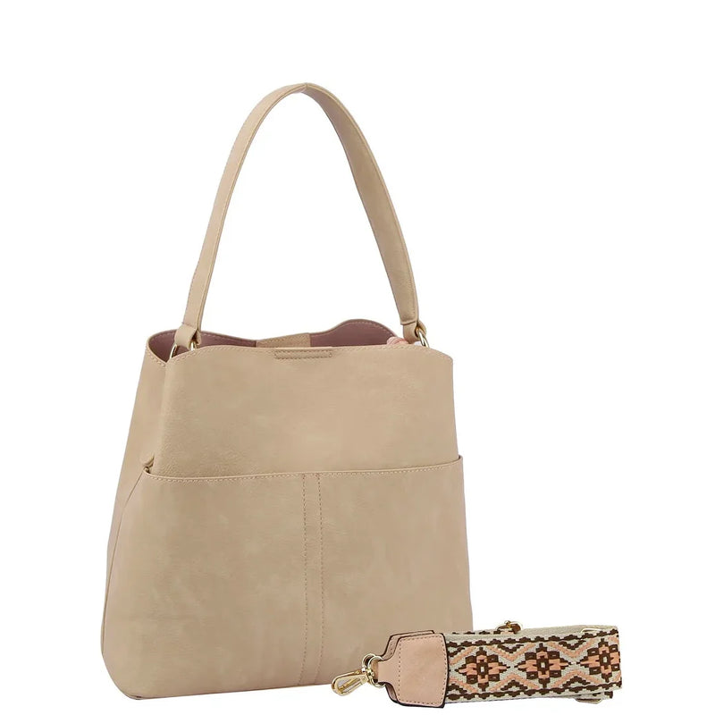 Beige leather bucket hobo bag with detachable patterned guitar strap