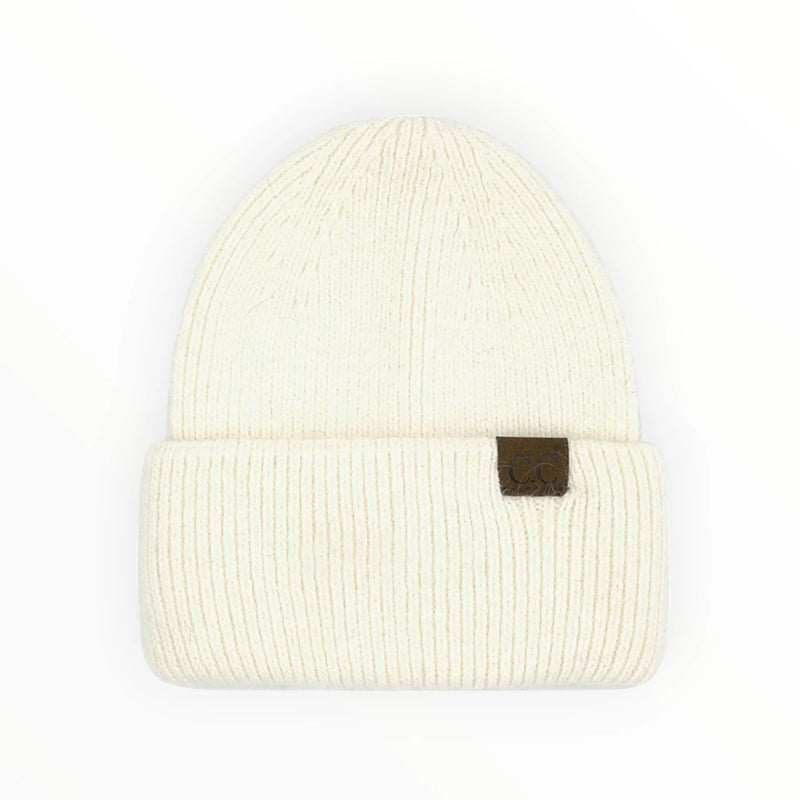 Cream-colored double cuff beanie with a brown leather patch for stylish warmth