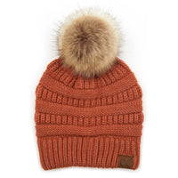 Rust-colored C.C. Natural Pom Knit Beanie with fluffy tan pompom on top