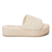 Cream-colored Cairo Raffia Platform Sandal with textured sole and woven design