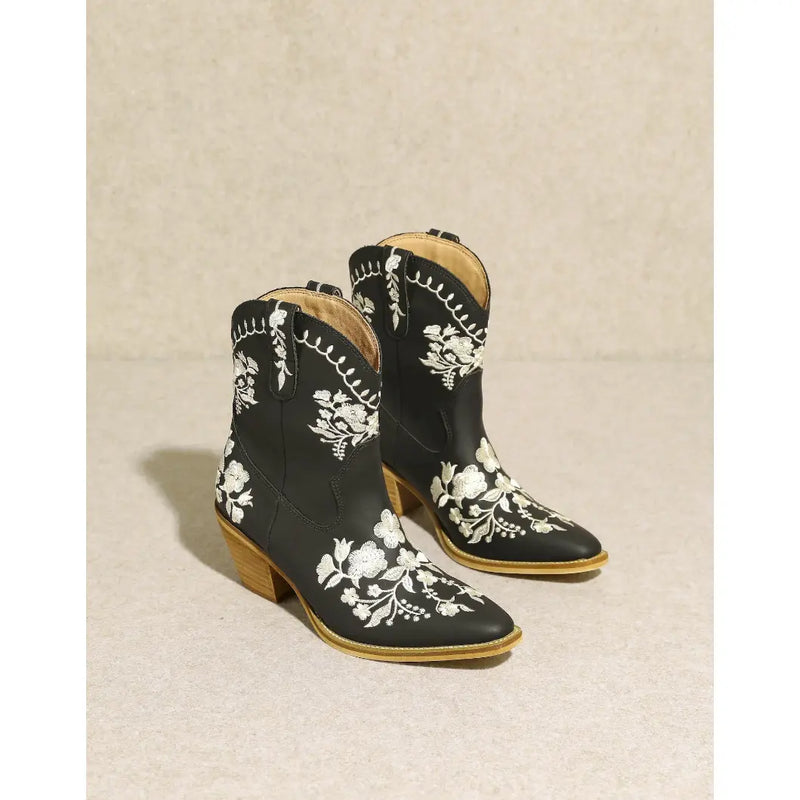 Black Carolina Flora Cowgirl Bootie with white floral embroidery and tan soles