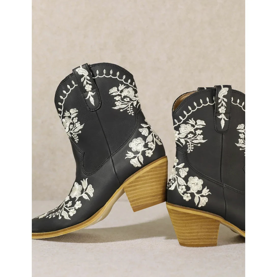 Black Carolina Flora Cowgirl Bootie with white floral embroidery and wooden heels