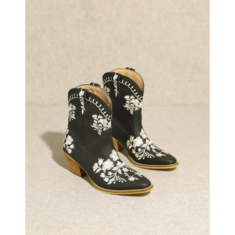 Black Carolina Flora Cowgirl Bootie with white floral embroidery and tan soles