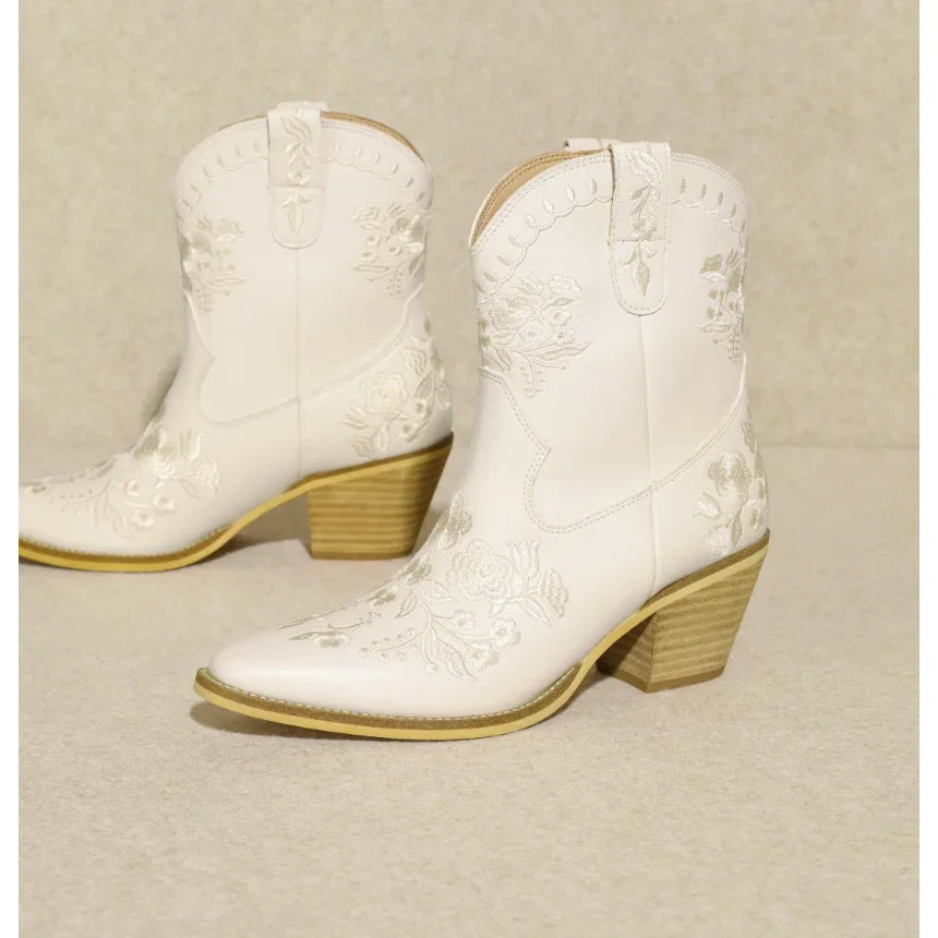 White Carolina Flora Cowgirl Bootie with embroidered details and wooden heels