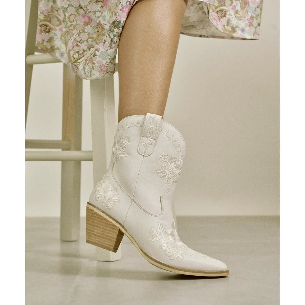 White Carolina Flora Cowgirl Bootie with embroidered details and pointed toe on wooden heel