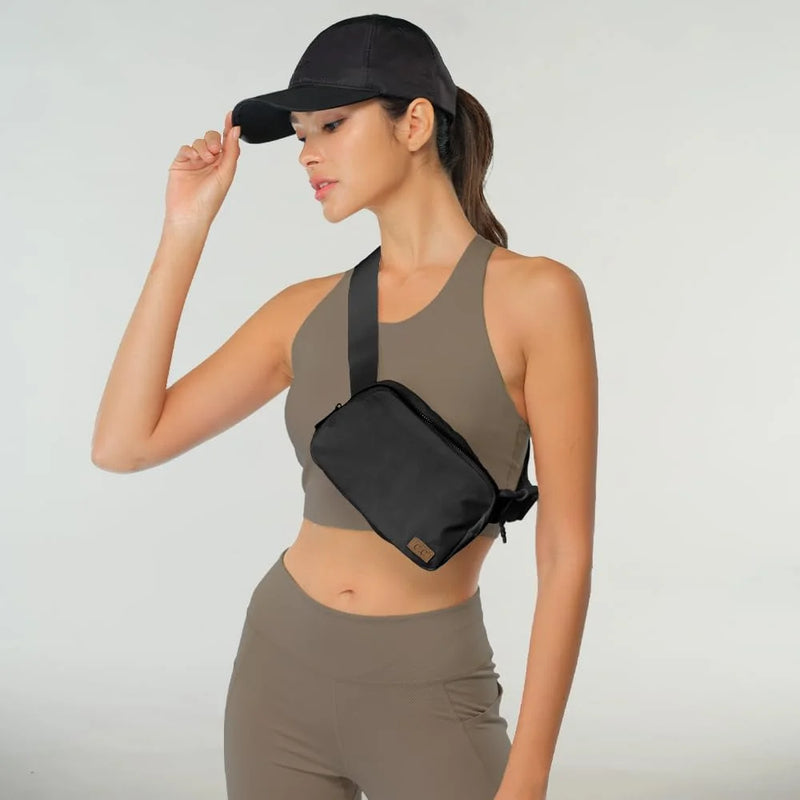 Woman in athletic wear with a baseball cap using a CC Waterproof Fanny Belt Bag