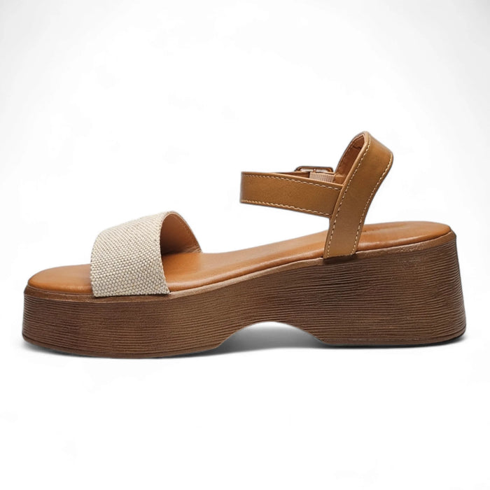 Chipper One Band Wedge featuring tan leather strap on textured beige front band