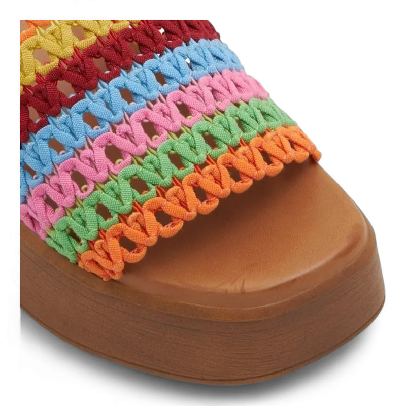 Colorful knitted fabric on a brown platform of a Wide Band Wedge shoe