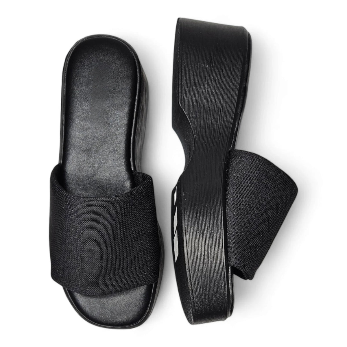 Pair of black platform slide sandals featuring wide straps from the Wide Band Wedge collection