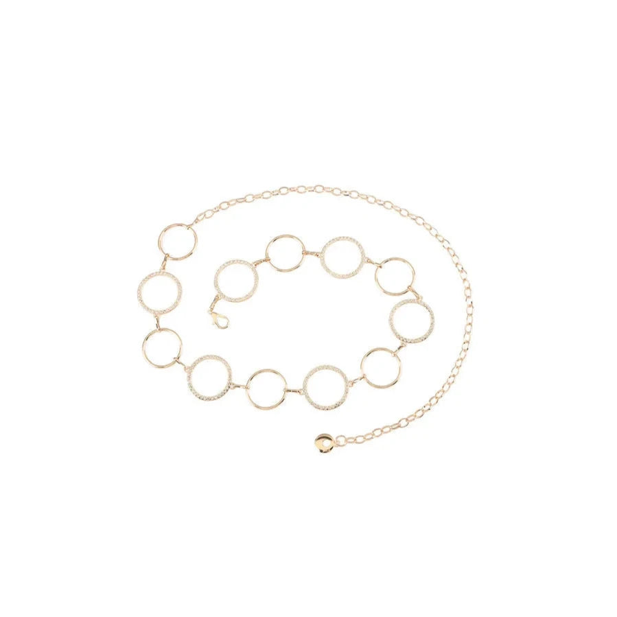 Delicate gold circle cutout chain belt featuring circular links of varying sizes