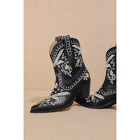 Pair of black Corral Cowgirl Bootie with intricate white embroidery designs