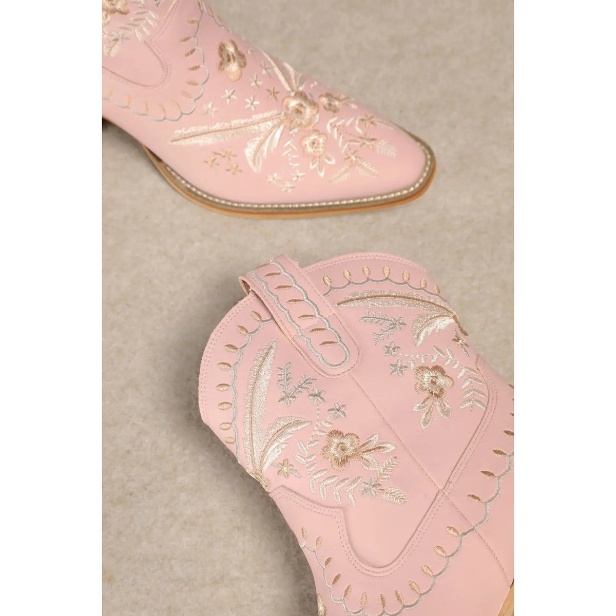 Pink leather Corral Cowgirl Bootie with floral embroidery and decorative stitching