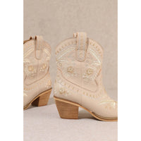 Ornate cream-colored Corral Cowgirl Bootie with floral embroidery and wooden heels