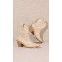 Cream-colored Corral Cowgirl Bootie with embroidered designs and pointed toes