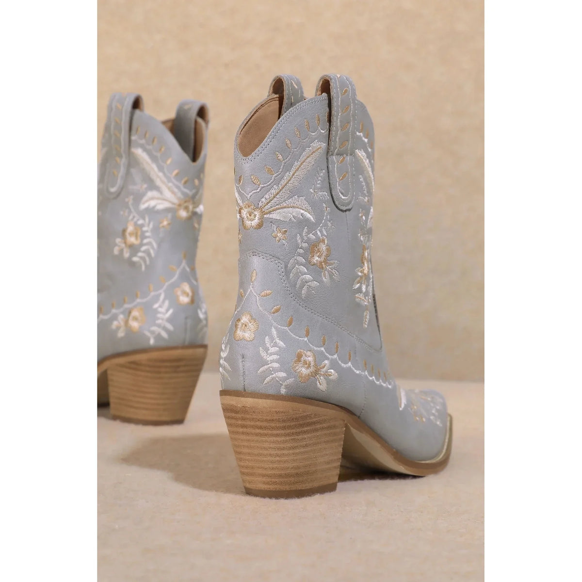 Light blue Corral Cowgirl Bootie with floral embroidery and wooden heels