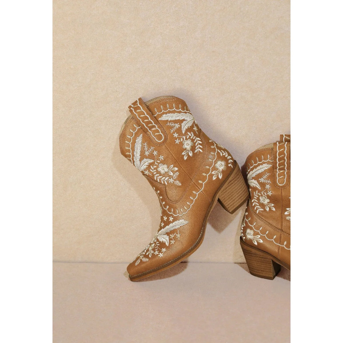 Tan leather ankle boots with floral embroidery and chunky heels from Corral Cowgirl Bootie