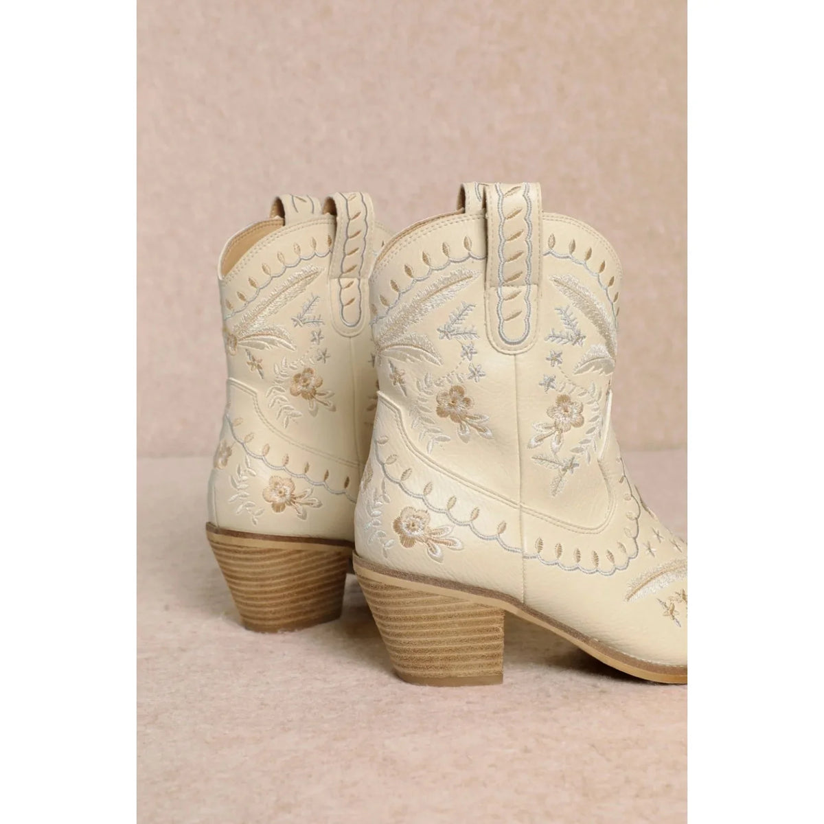 White leather Corral Cowgirl Bootie with floral embroidery and wood grain heel