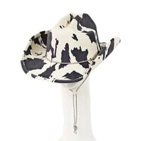 Cow Print Draw String Cowboy Hat featuring a stylish black and white cow print pattern