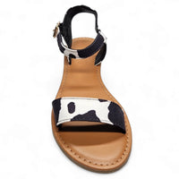 Cow Print Sandal featuring a black ankle strap and cow print front strap design