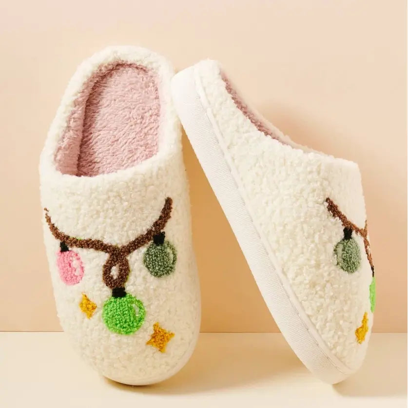 Cozy Christmas Light Bulb Slippers with white fuzzy texture and colorful pom-poms