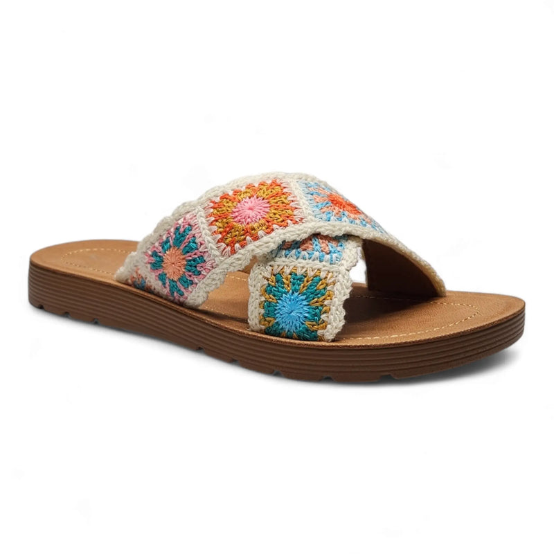 Embroidered criss cross crochet slides with colorful floral patterns on wooden sole