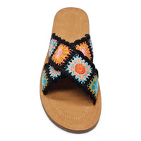 Colorful Criss Cross Crochet Slides with vibrant floral pattern and tan sole