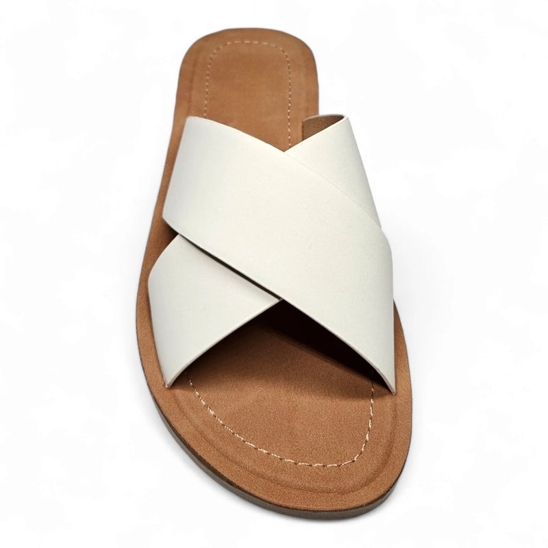 White leather criss cross sandal slides with tan sole for stylish summer wear