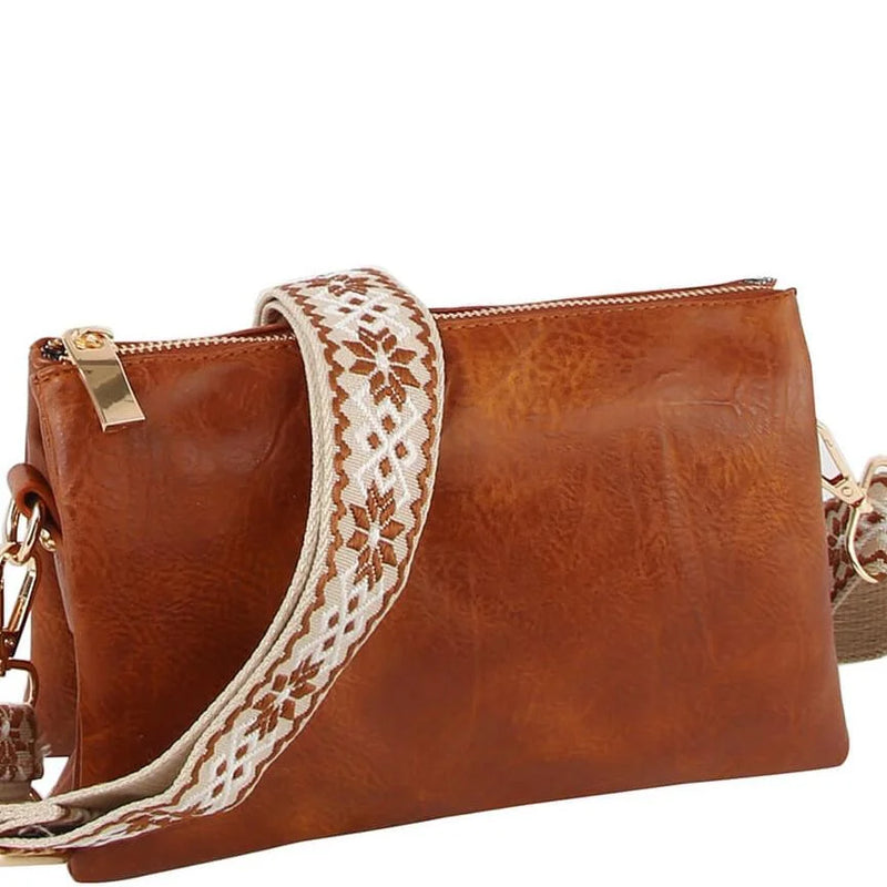 Brown leather crossbody bag clutch with decorative embroidered guitar strap