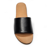 Black leather Daily Slide sandal featuring a tan footbed for ultimate comfort