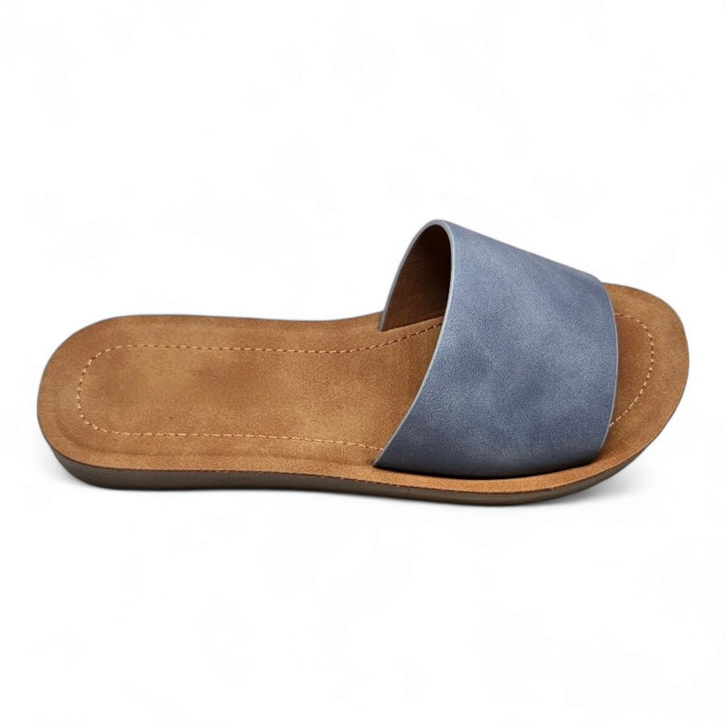 Blue leather slide sandal with tan footbed and sole, perfect for daily wear