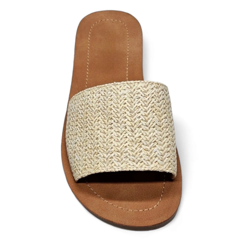 Woven straw slide sandal with tan leather sole in Daily Slip On Flat Sandal design