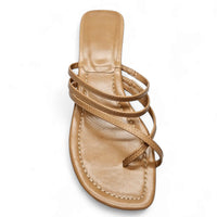 Strappy gold leather toe strap slide kitten heel sandal with flat sole and toe loop