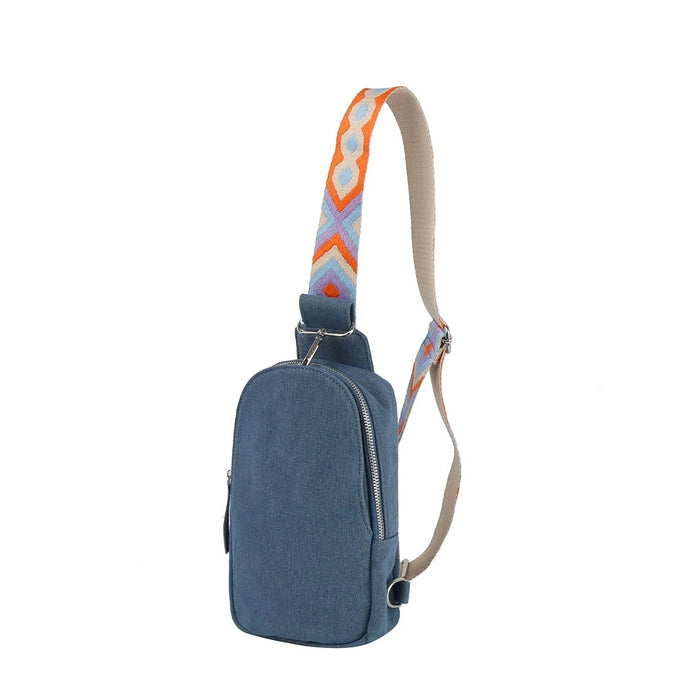 Blue Denim Sling Bag with colorful Aztec Guitar Strap showcasing unique style