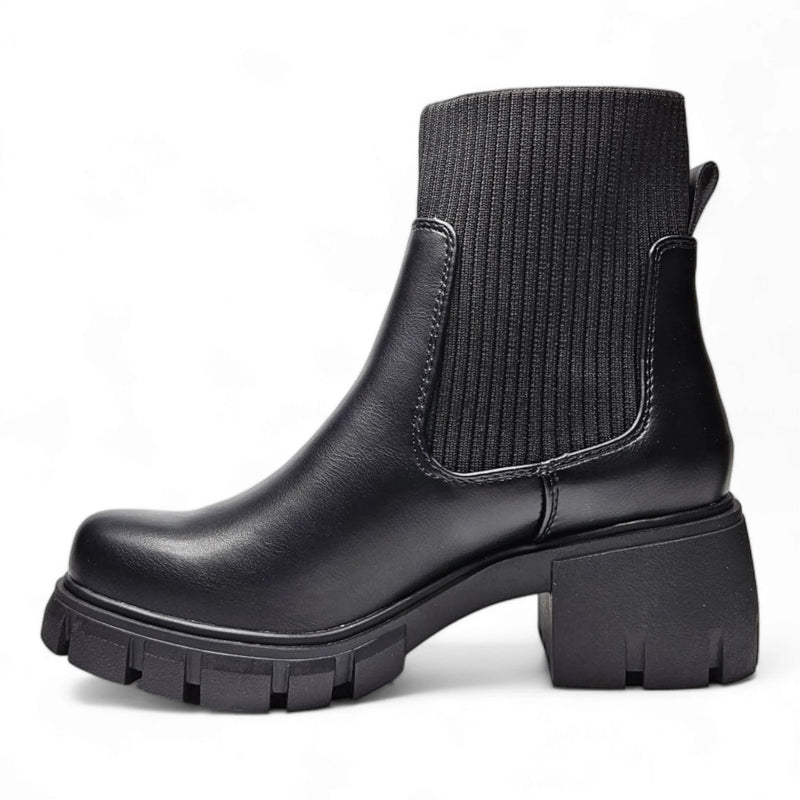 Black leather Elastic Shaft Lug Bootie featuring chunky sole and ribbed fabric upper