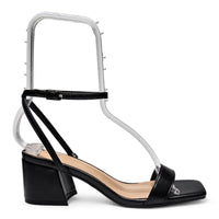 Black patent leather sandal with chunky low block heel and ankle strap in stylish design