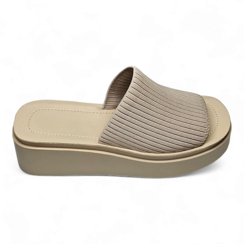 Beige Platform Slinky Slide Sandal with ribbed fabric upper; height measures approximately stylish