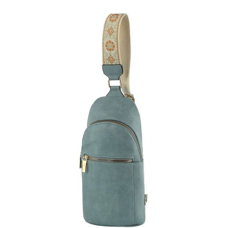 Teal leather sling backpack featuring a decorative fabric strap for the Fashion Zipper Strap