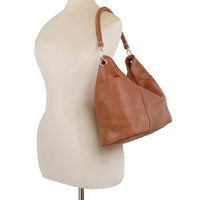 Brown leather fashion braided top handle shoulder bag on mannequin torso