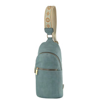 Teal leather sling backpack featuring a decorative fabric strap for the Fashion Zipper Strap