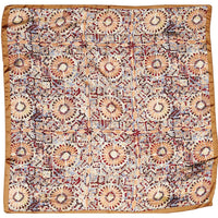 Patterned silk scarf featuring firework print with floral and geometric designs in muted colors