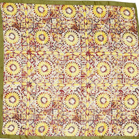 Patterned square scarf featuring sunflower designs with olive green border and firework print