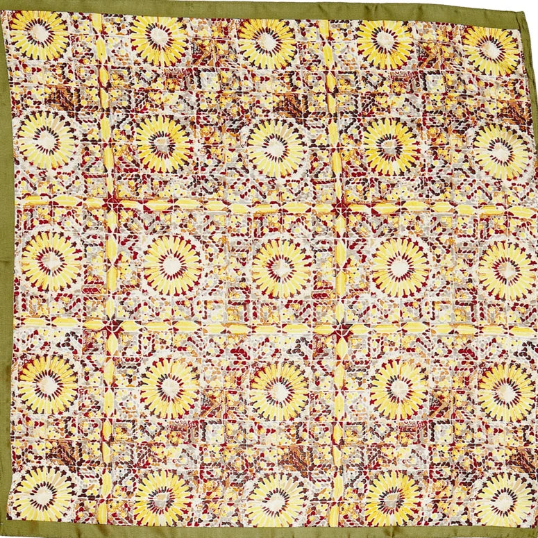 Patterned square scarf featuring sunflower designs with olive green border and firework print