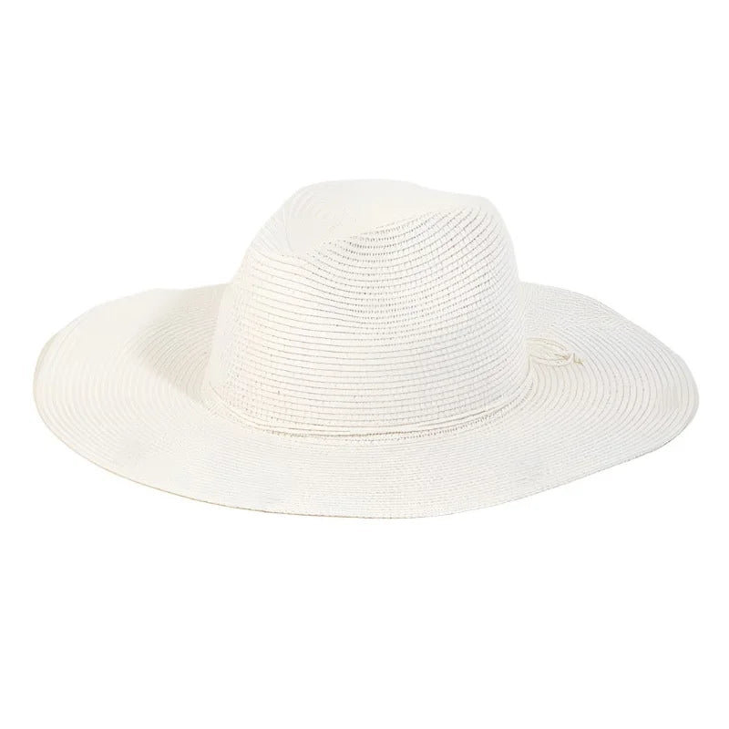 White floppy fedora straw sun hat with a wide brim made of woven material