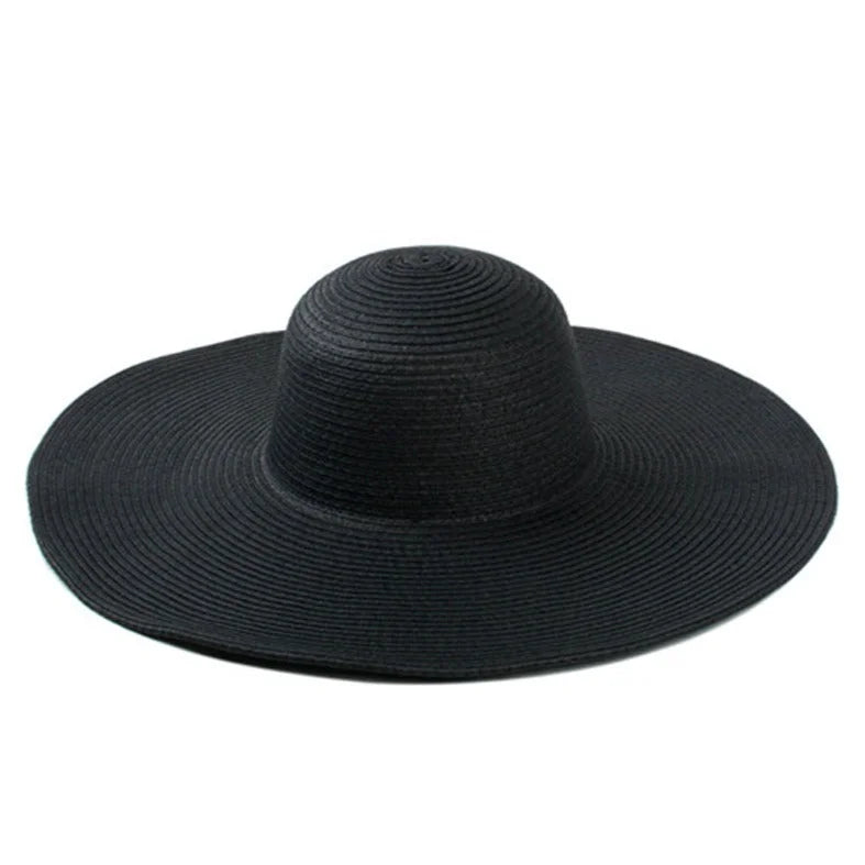 Black floppy oversized sun hat with a wide brim and rounded crown for style and sun protection