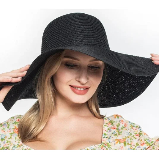 Wide-brimmed black floppy oversized sun hat with a stylish floppy brim