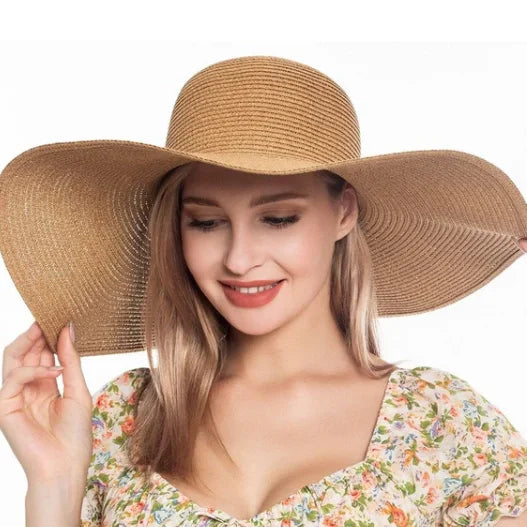 Woman wearing a floppy oversized sun hat, perfect for sun protection and style