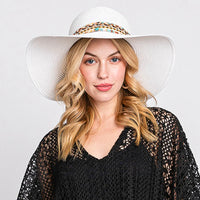 White floppy straw hat with a colorful boho sea life band for stylish sun protection