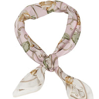 Floral pattern silk scarf elegantly tied in a loop showcasing its vibrant design