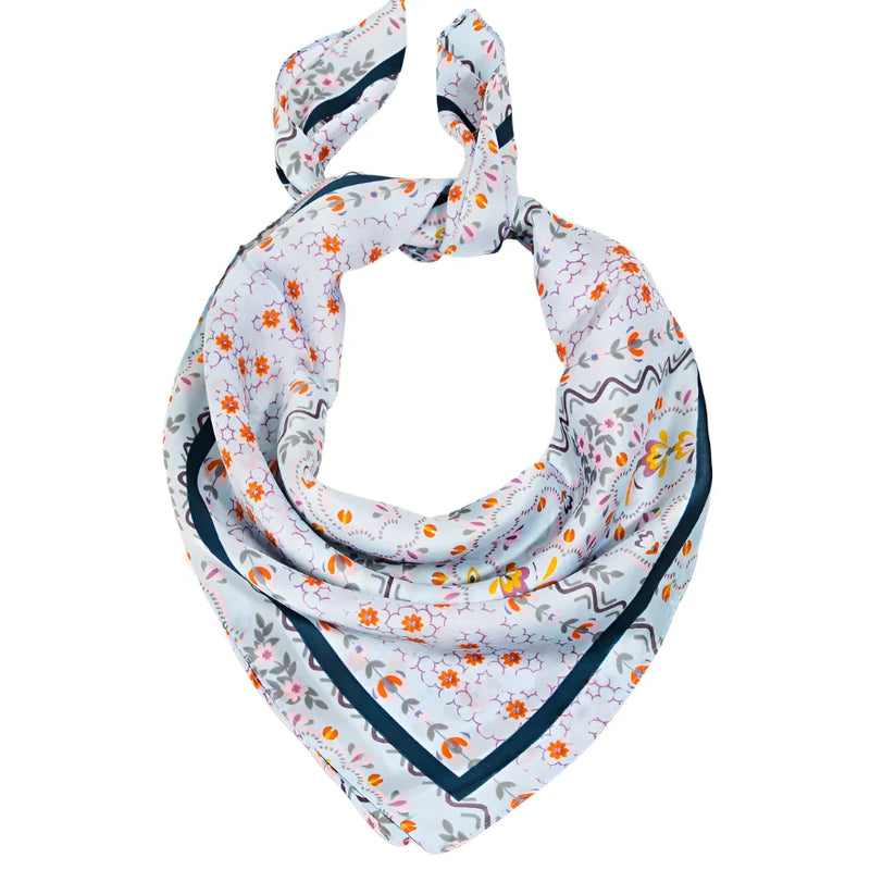 Floral print satin scarf showcasing vibrant floral motifs on a light background